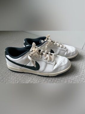 Nike White Low-Top Sneakers with Dark Green Swoosh